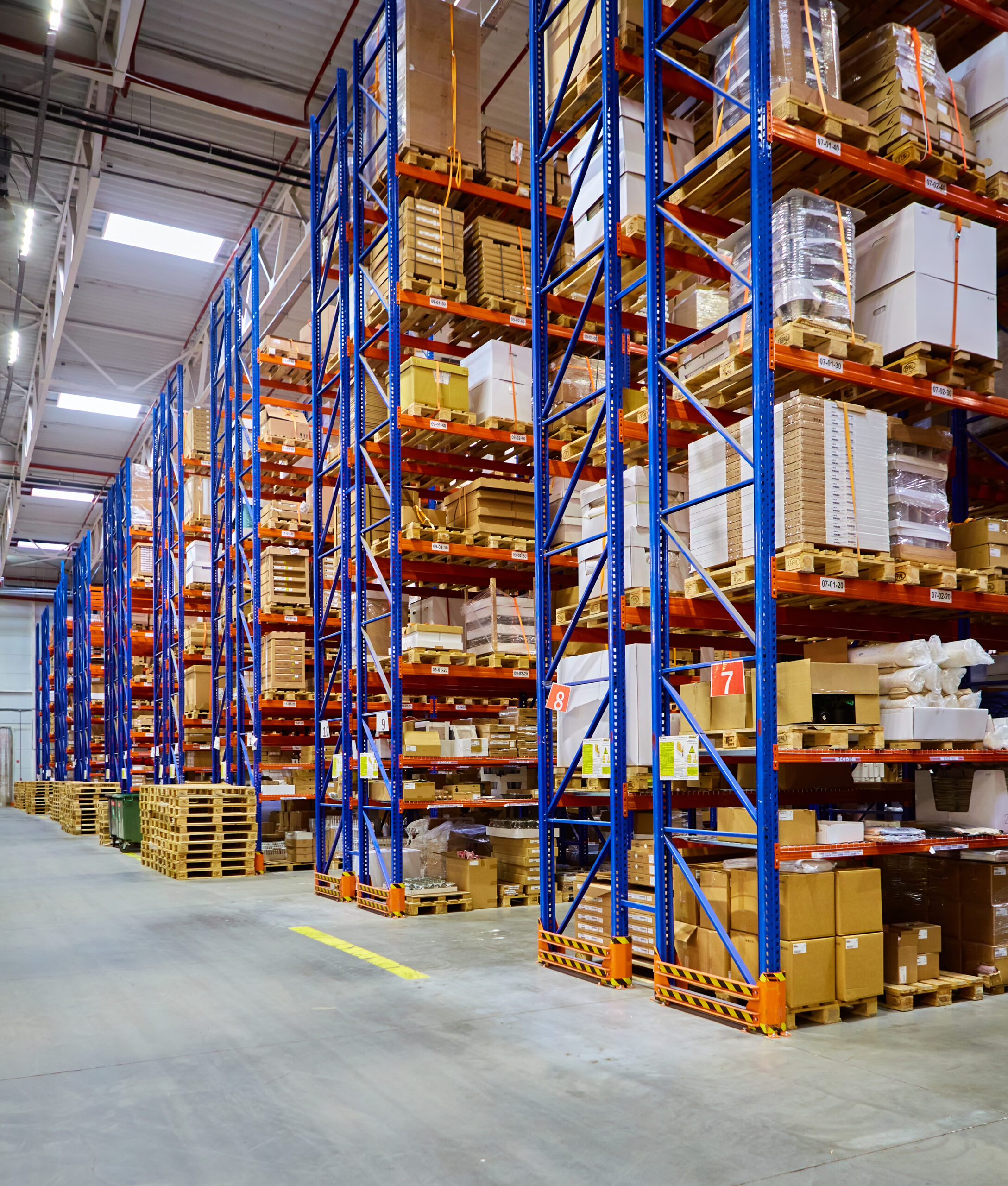huge-distribution-warehouse-with-high-shelves-loaders (1)